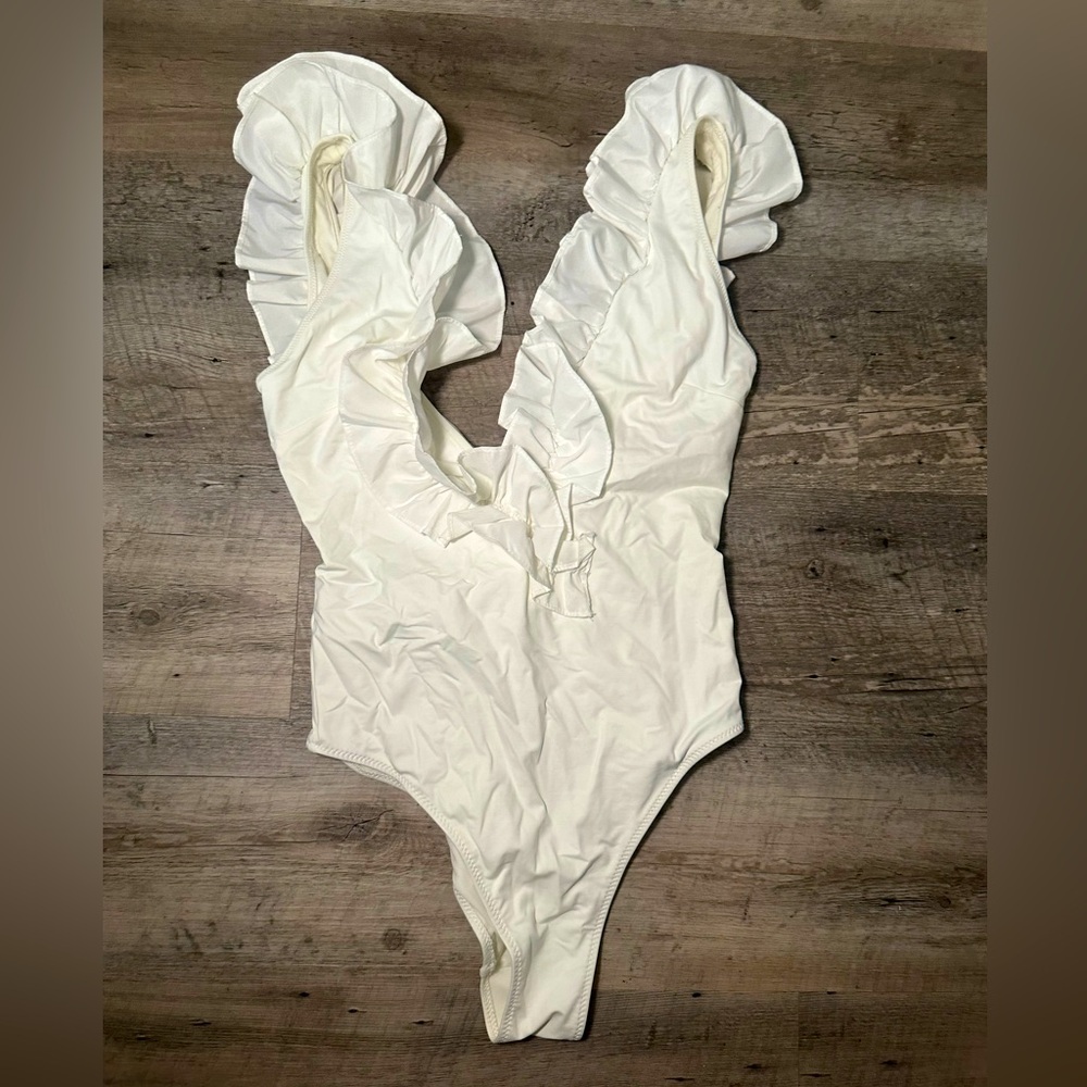 Ruffled white swimsuit
